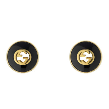Clous d'oreilles Gucci...