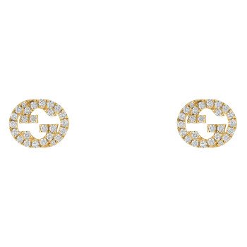 Clous d'oreilles Gucci...